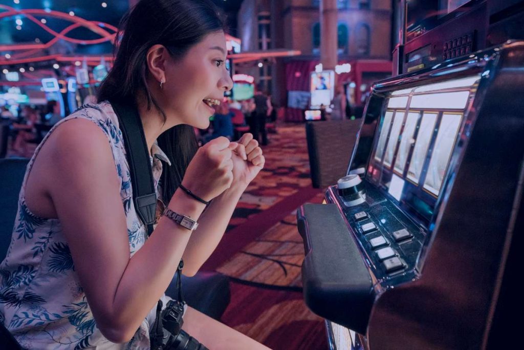 lady playing slot machine