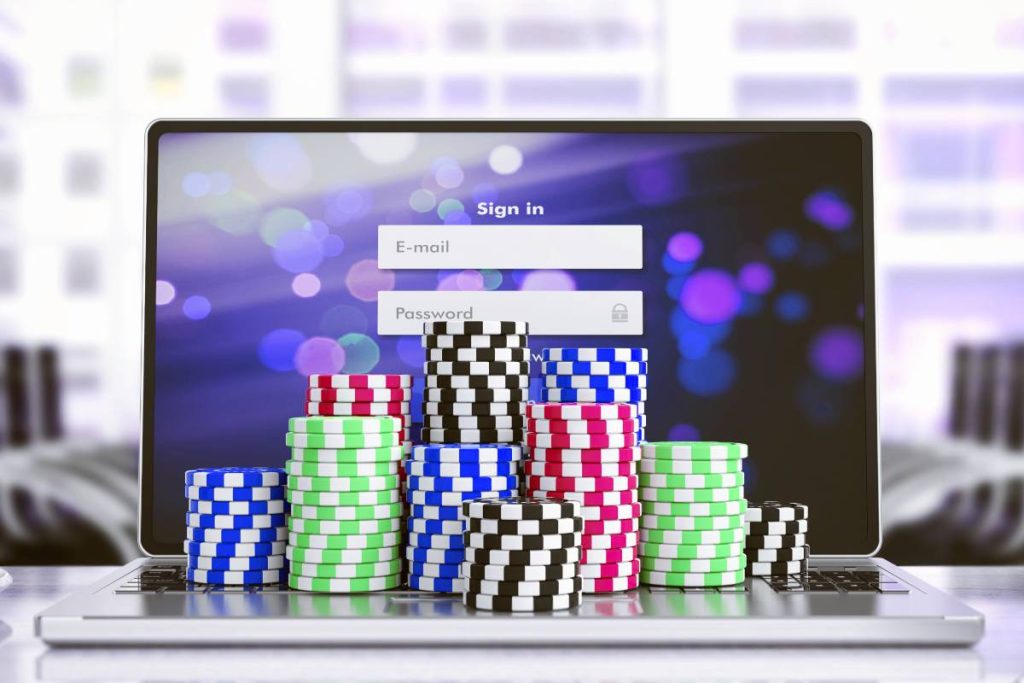 Online gambling with chips on laptop